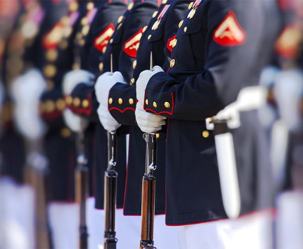 line of soldiers wearing formal uniforms